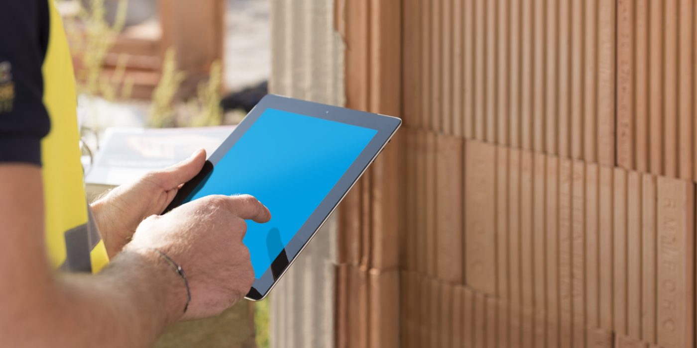 Construction worker with tablet computer